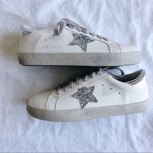White sneakers with silver star